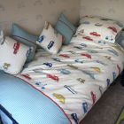 Duvet cover with matching pillow cases and cushions.