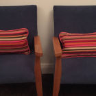 Two cute matching piped cushions for children&#039;s chairs