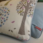 Cushions piped and backed in contrast blue