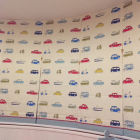5 children&#039;s blinds with red ric rac and gingham edge on a curved bay